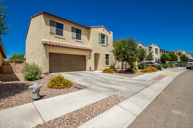 mediterranean / spanish-style home featuring a garage