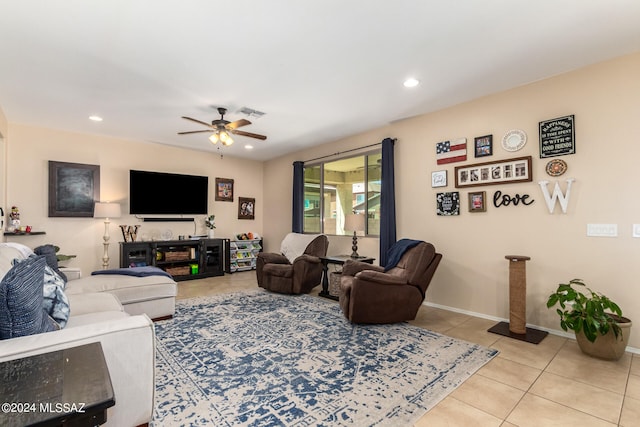 tiled living room featuring ceiling fan