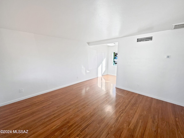 unfurnished living room featuring wood-type flooring