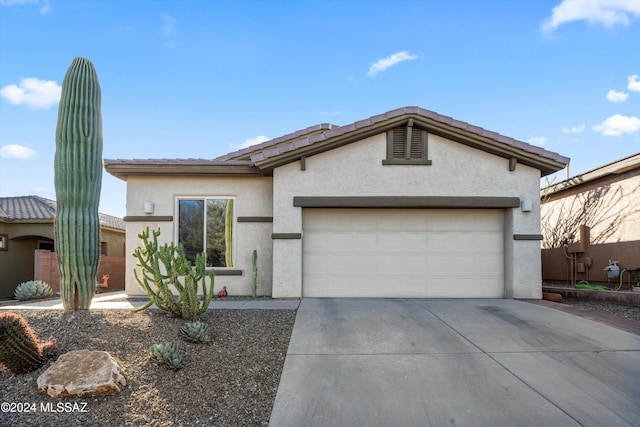 view of front of home with a garage