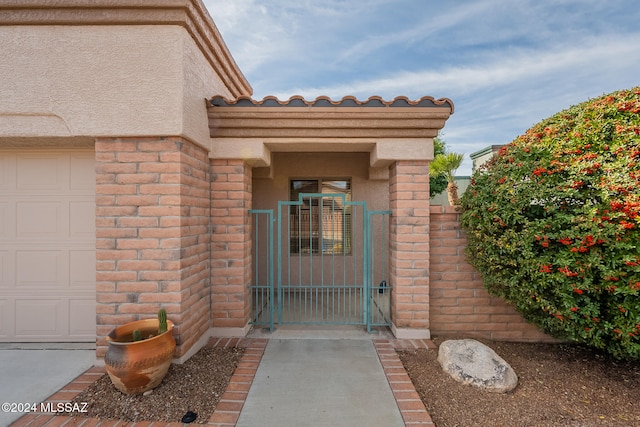 entrance to property featuring a garage