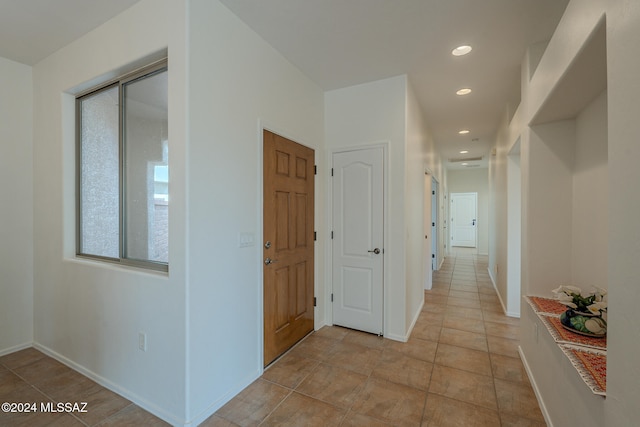 interior space featuring carpet floors and ceiling fan with notable chandelier