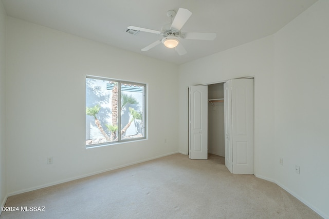 unfurnished bedroom with light carpet and ceiling fan