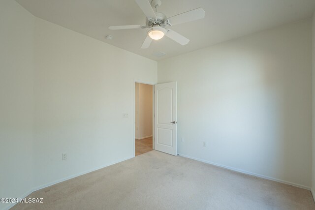 washroom featuring washer and dryer, cabinets, and light tile patterned flooring