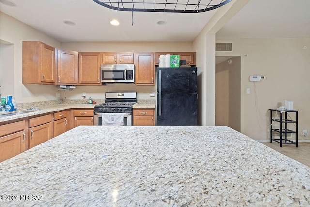 kitchen featuring appliances with stainless steel finishes and sink