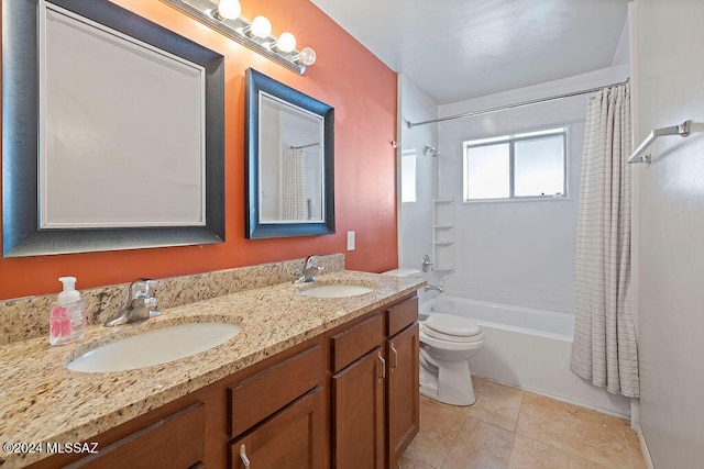 full bathroom featuring toilet, shower / tub combo with curtain, vanity, and tile patterned floors