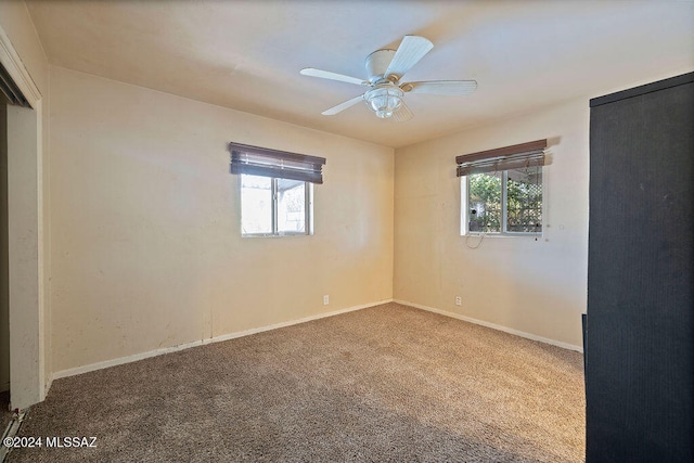 carpeted empty room with ceiling fan