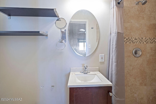 bathroom featuring vanity and a shower with curtain