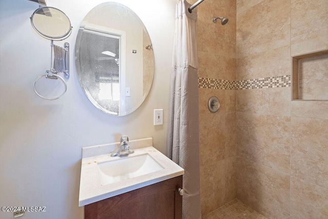 bathroom with vanity and a shower with shower curtain