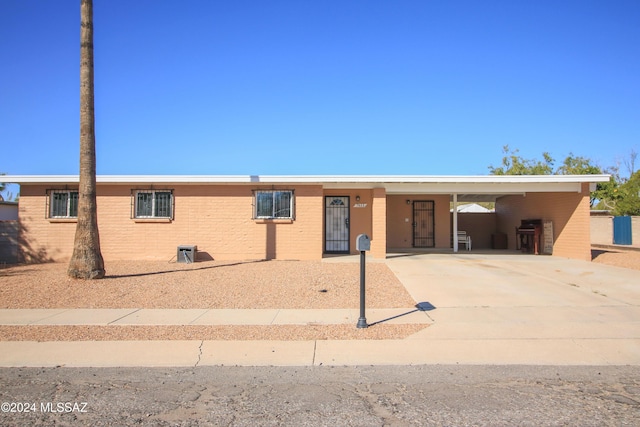 single story home with a carport