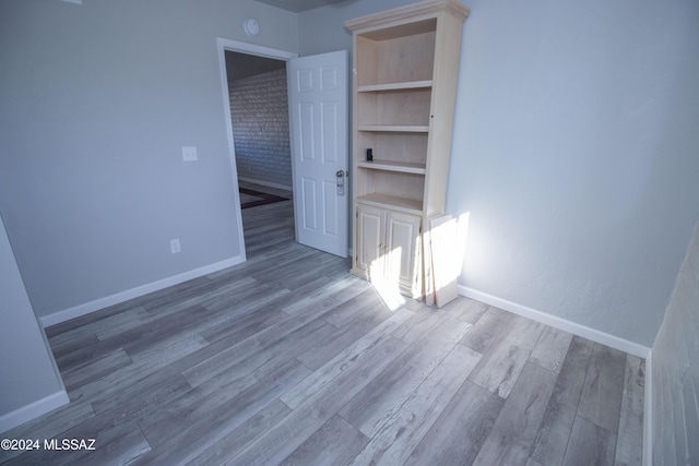 empty room with hardwood / wood-style flooring