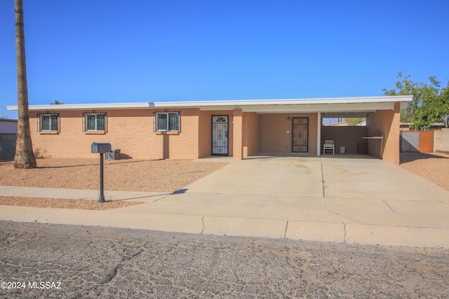 view of front of property with a carport