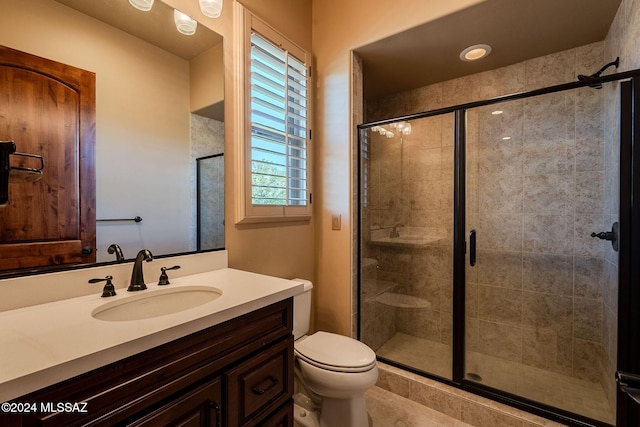 full bath with toilet, a stall shower, and vanity