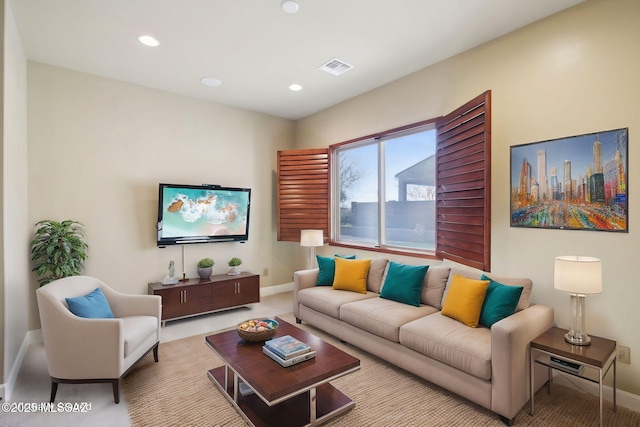 living room featuring recessed lighting, light carpet, visible vents, and baseboards