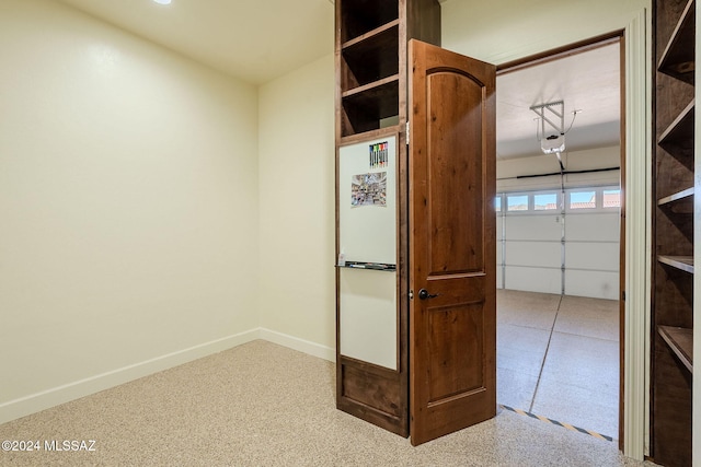 interior space featuring baseboards