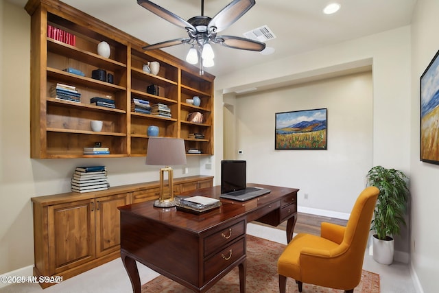 home office featuring a ceiling fan, visible vents, and baseboards