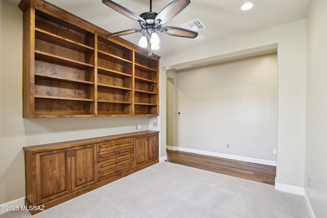 unfurnished office with light carpet, baseboards, visible vents, ceiling fan, and recessed lighting