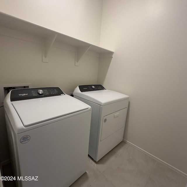 clothes washing area with washer and dryer