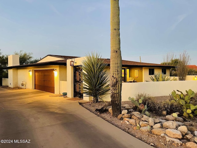 view of front of property featuring a garage