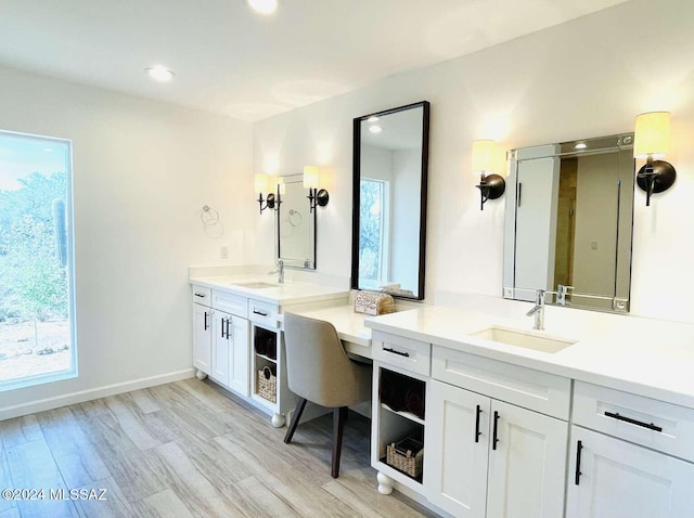 bathroom with vanity and wood-type flooring