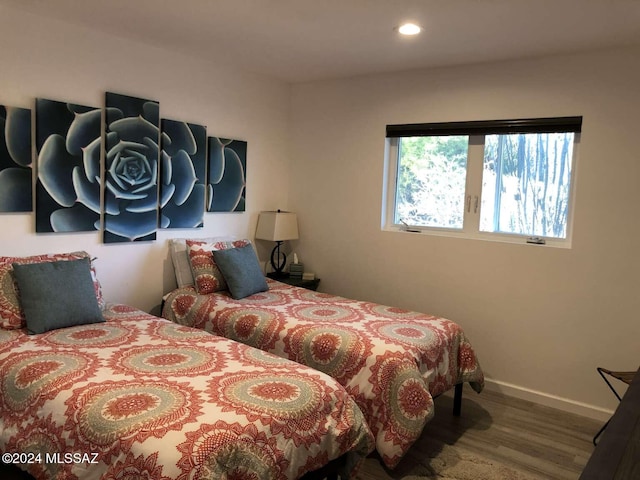 bedroom featuring wood-type flooring