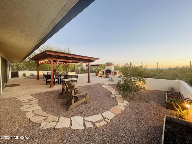 patio terrace at dusk with a gazebo