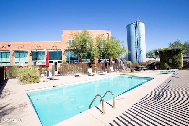 view of swimming pool featuring a patio area