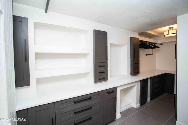 kitchen featuring dark tile patterned flooring