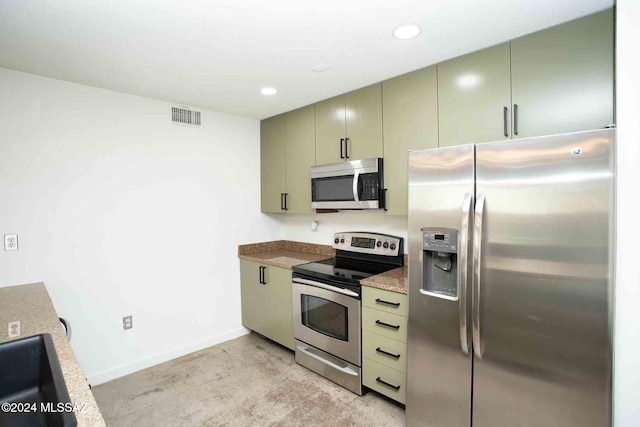 kitchen featuring appliances with stainless steel finishes and green cabinetry