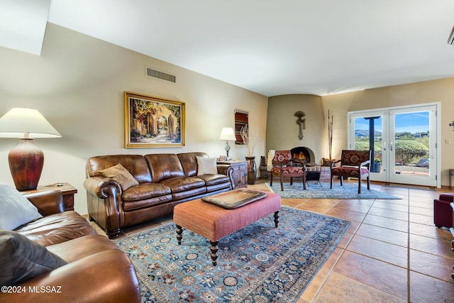 living room with french doors and tile patterned floors