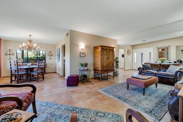 tiled living room featuring a chandelier