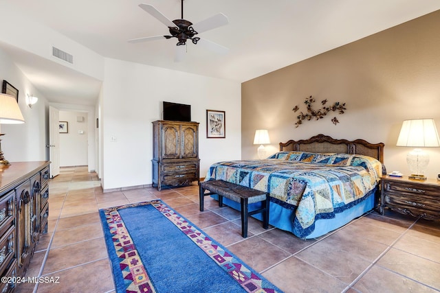 bedroom with tile patterned flooring and ceiling fan