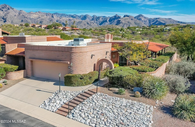 view of front of home featuring a mountain view