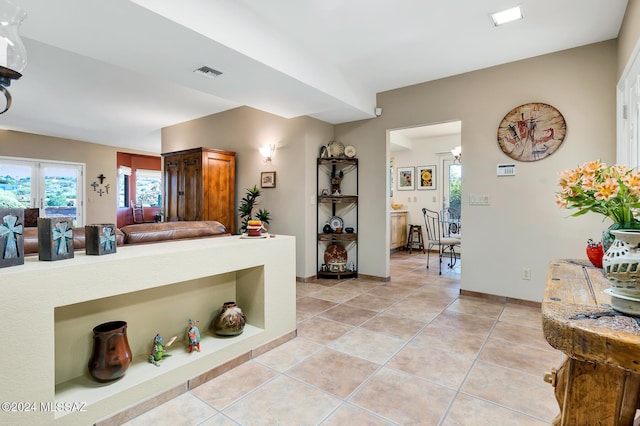 kitchen with a healthy amount of sunlight and light tile patterned floors