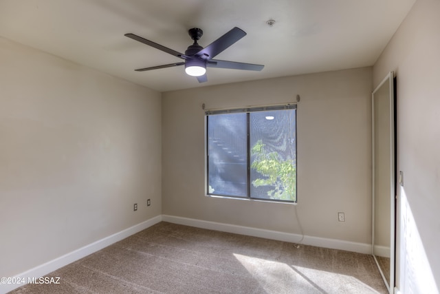 empty room featuring carpet and ceiling fan