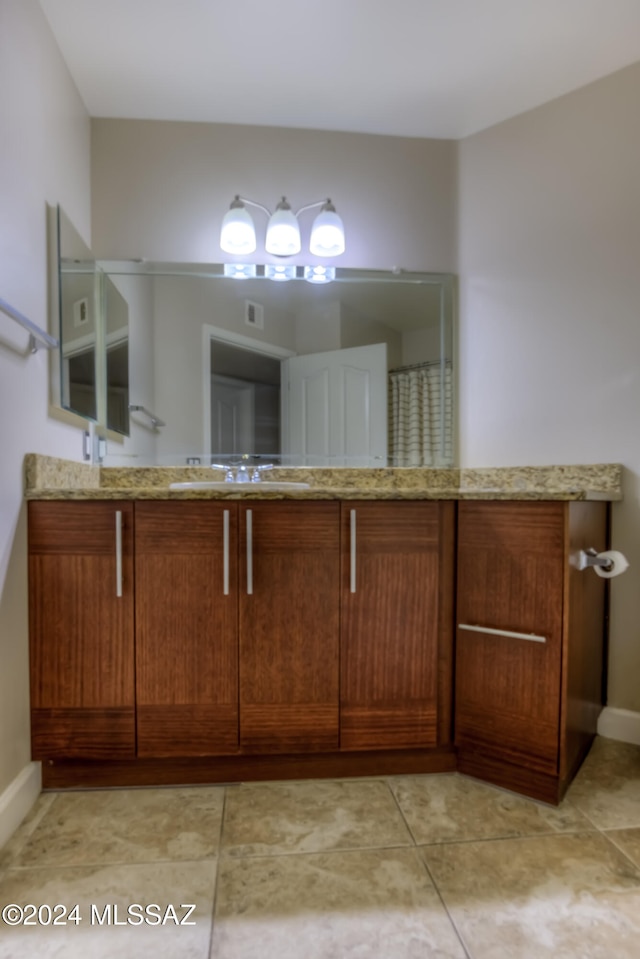 bathroom with vanity and tile patterned flooring