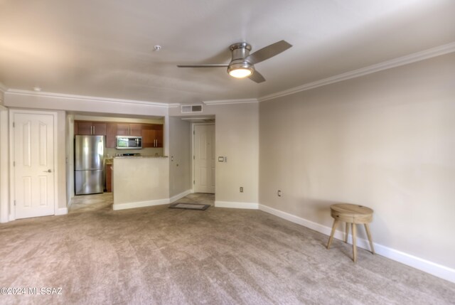 unfurnished living room with crown molding, light colored carpet, and ceiling fan