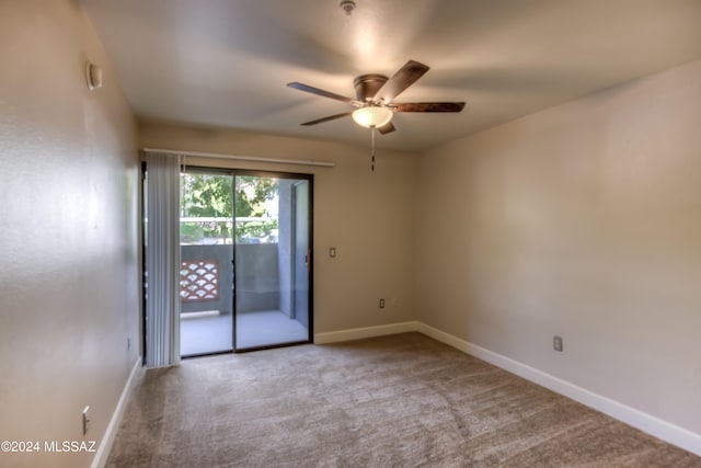 unfurnished room featuring light colored carpet and ceiling fan