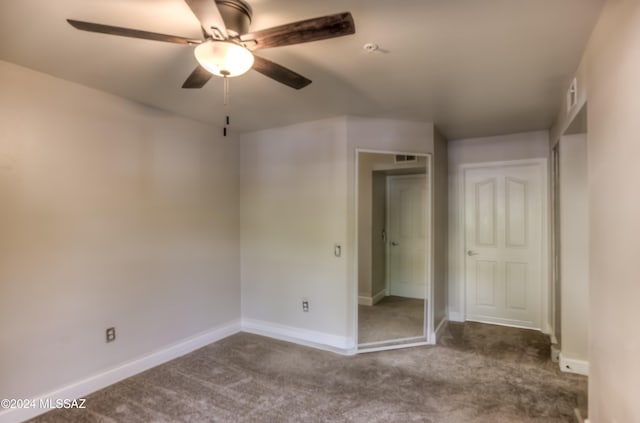 unfurnished bedroom featuring a closet, ceiling fan, and carpet floors