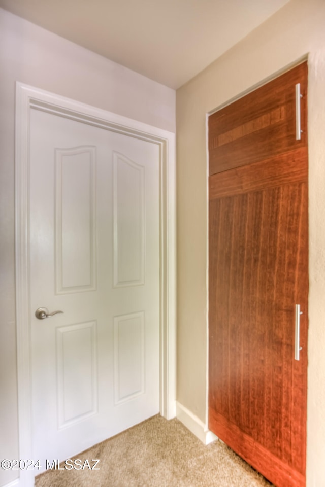 unfurnished bedroom featuring a closet and carpet