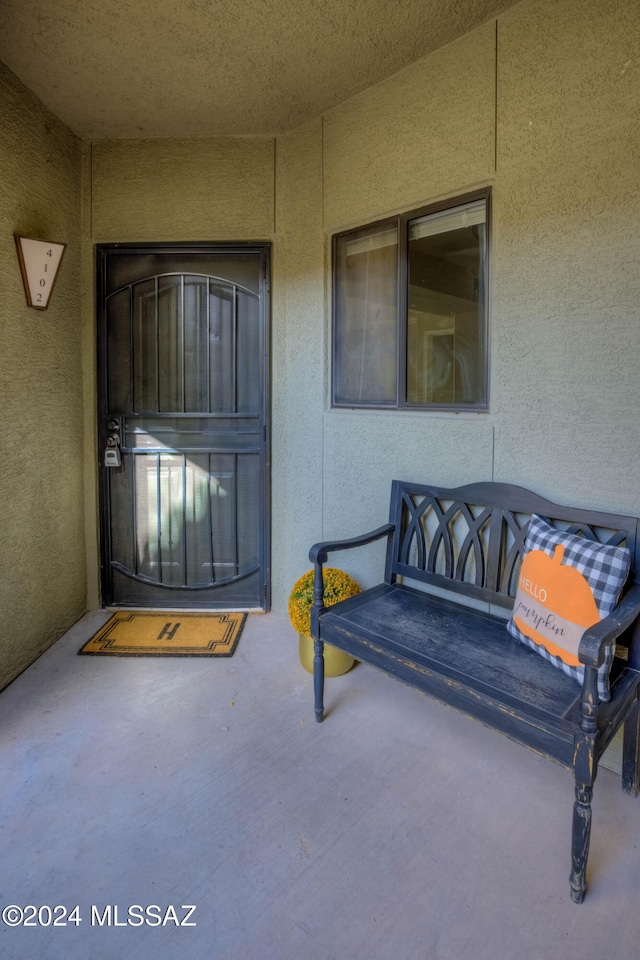 entrance to property featuring a patio area