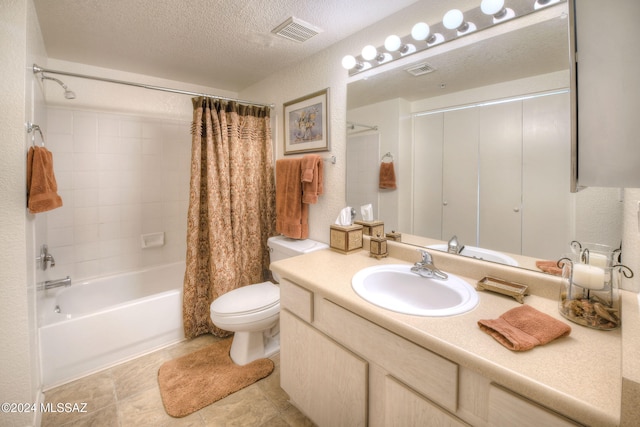 full bathroom with vanity, tile patterned flooring, toilet, a textured ceiling, and shower / tub combo with curtain