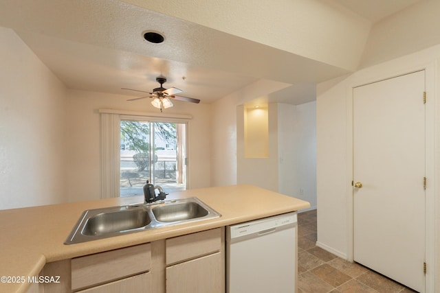 kitchen with a sink, a ceiling fan, dishwasher, and light countertops