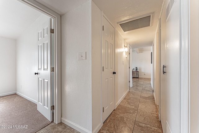 hallway with light tile patterned flooring