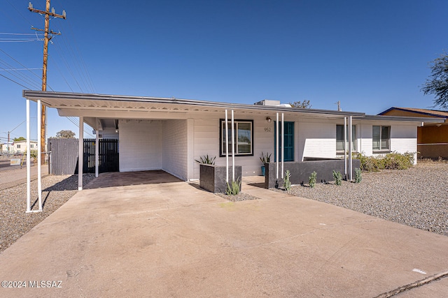 view of front of house with a carport