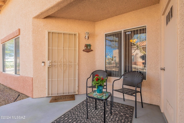 property entrance with a patio area