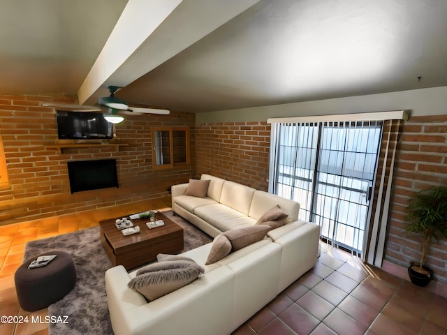 living room featuring brick wall, ceiling fan, and tile patterned floors