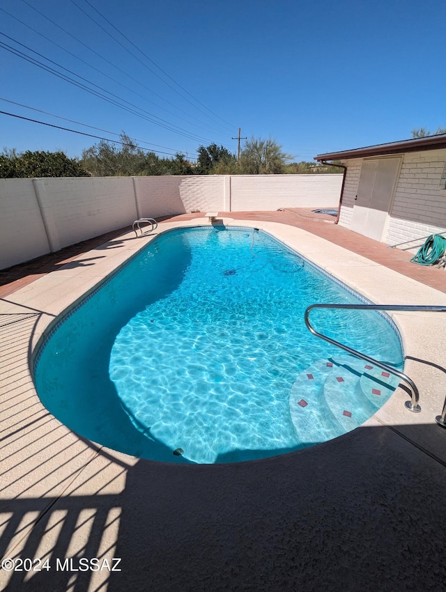 view of pool with a patio