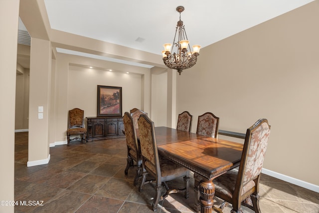 dining space with a chandelier