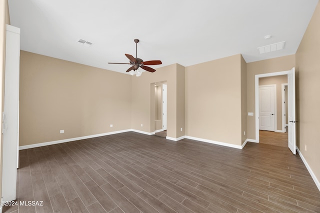 unfurnished room with dark hardwood / wood-style flooring and ceiling fan